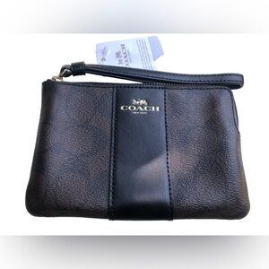 Brand new coach wristlet with tags. Dark brown color.